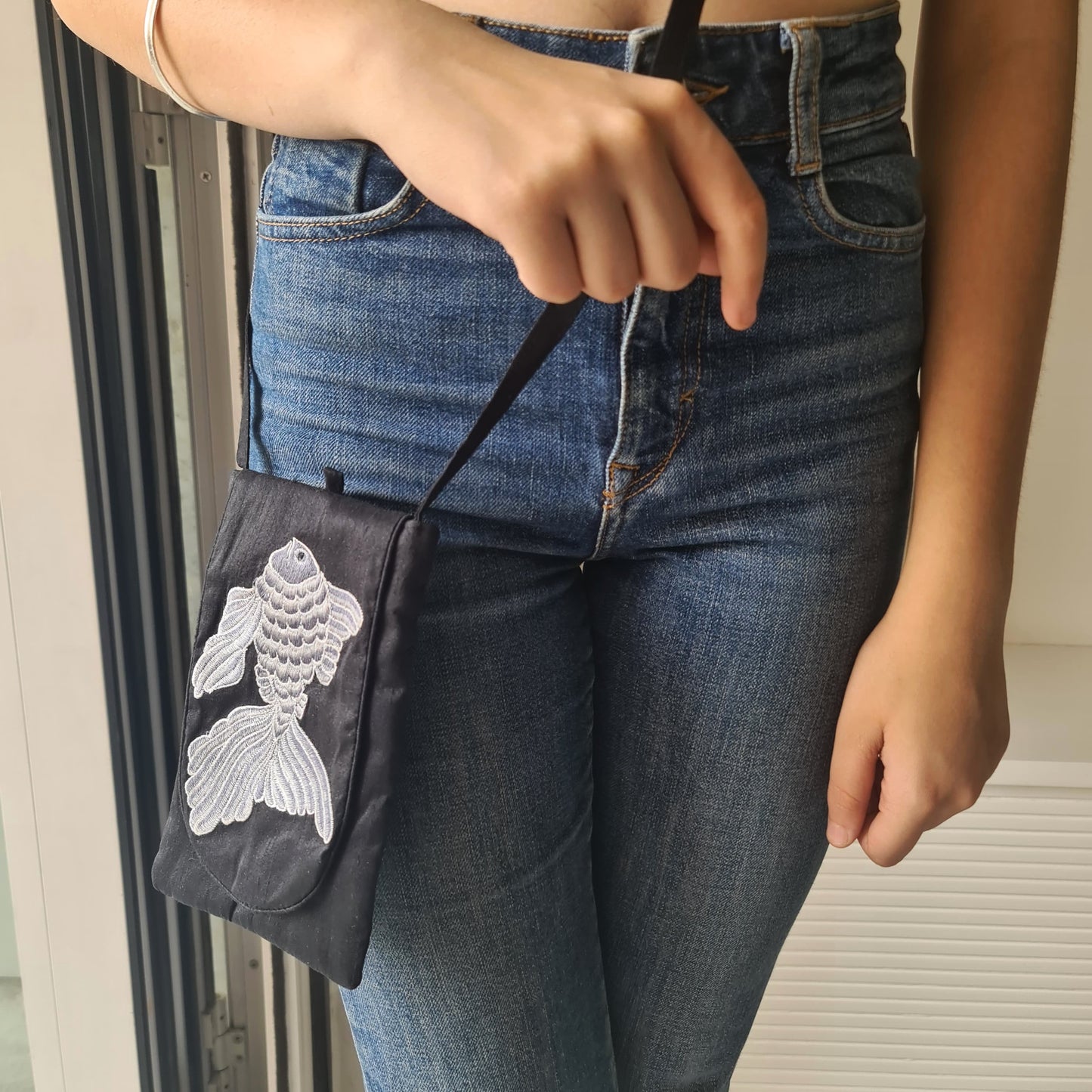 Embroidered silk fish sling